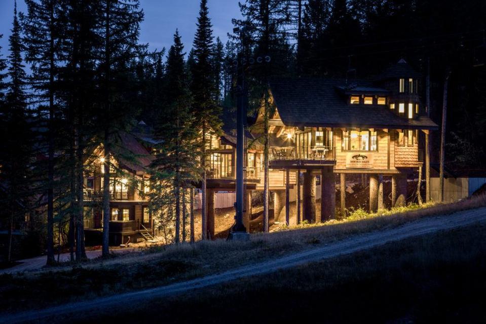 whitefish resort treehouse chalets lights glow at night