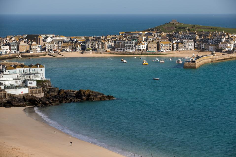 The picturesque Cornish town of St. Ives, complete with sandy beaches and blue water.