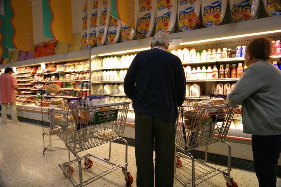 Senior Couple, Shopping In A Supermarket