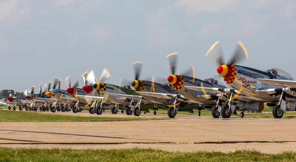 A lineup of P-51 Mustangs at AirVenture 2019.