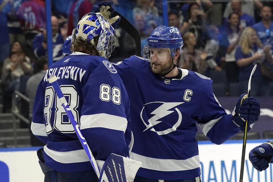 The Tampa Bay Lightning's Steven Stamkos and Andrei Vasilevskiy celebrate a win.