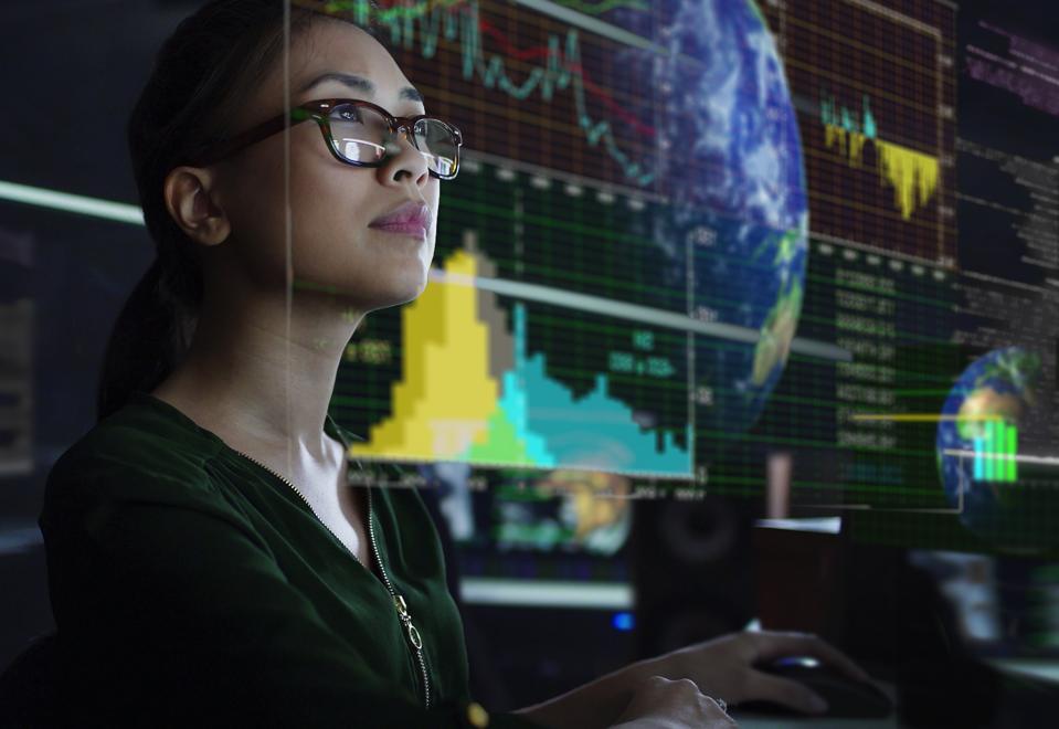 Data analyst looking at global data in real time to discover emerging trends.