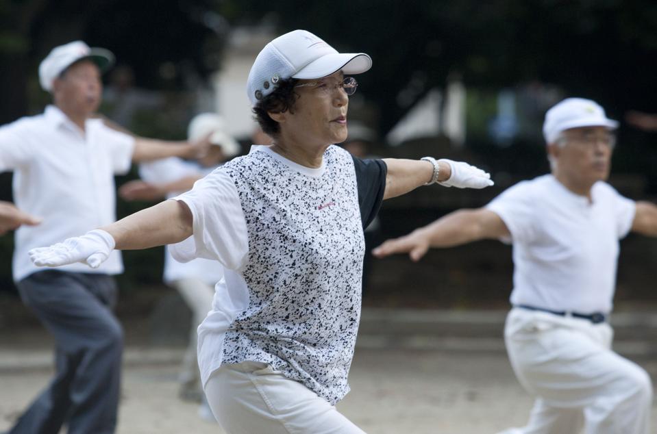 Elderly People Exercise Early Morning In Park