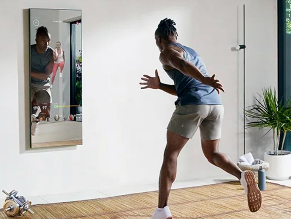 a man working out in front of a mirror