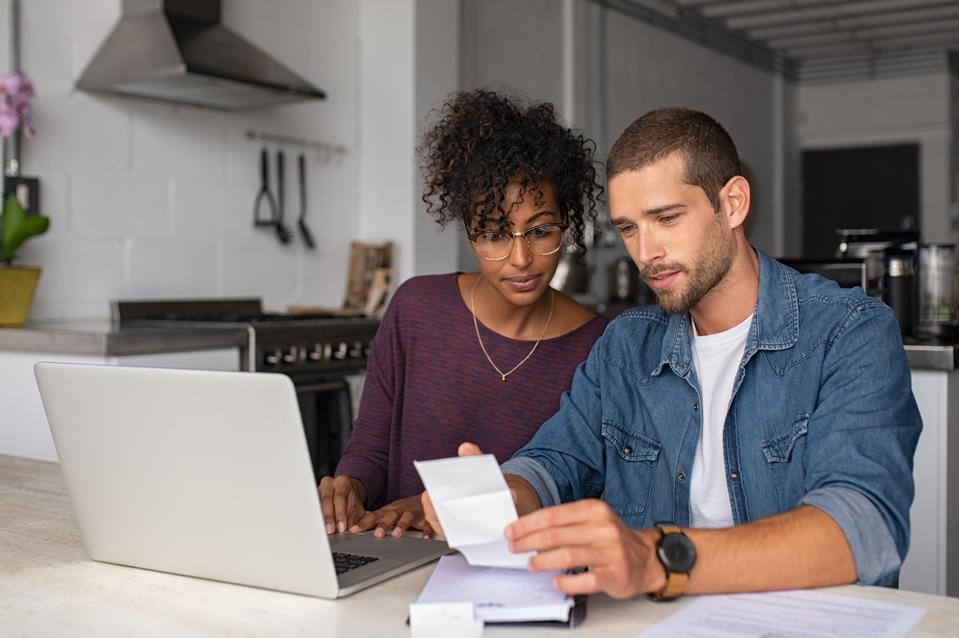 Young couple examining financial documents