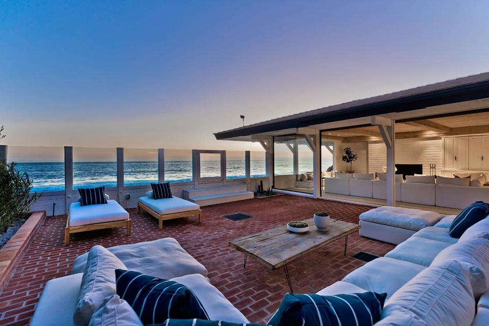 oceanfront decking and living room at 23334 Malibu Colony Rd Malibu, CA, USA