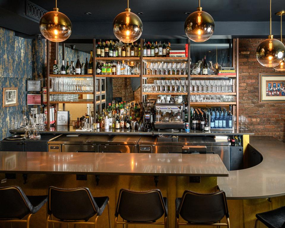The bar at Contento; the area to the right accommodates guests in wheelchairs.