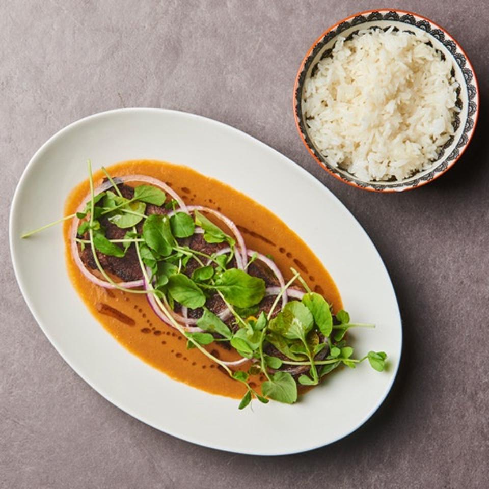 Chef Oscar Lorenzzi's short ribs in peanut sauce with a side of jasmine rice.