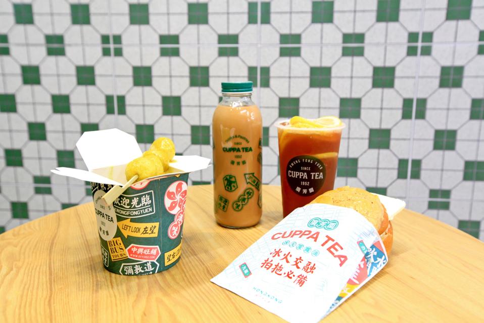 Left to right: Curried fish balls, milk tea, fresh lemon black tea, and a pineapple bun with salted butter.