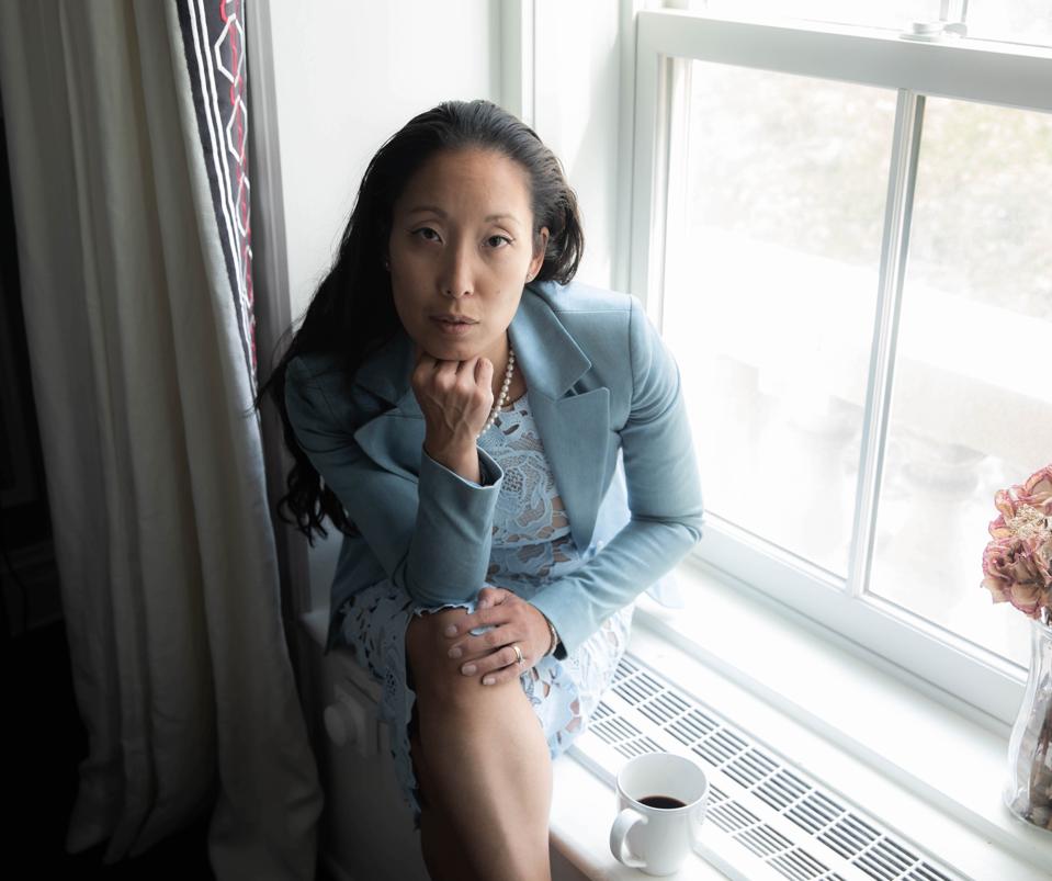 Joanne Lee Molinaro in a powder blue blazer and matching lace dress