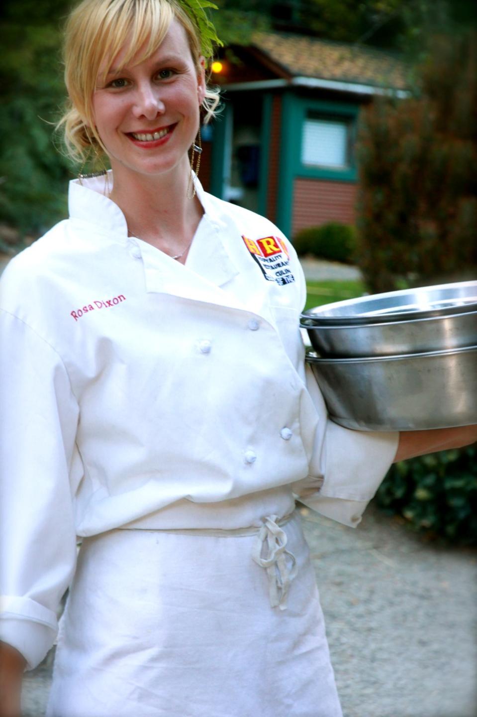 Headshot of Dixon in chef's apron