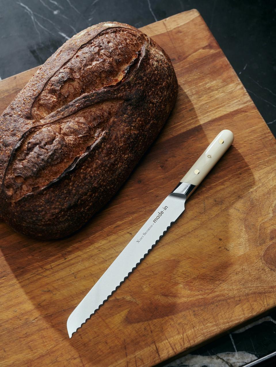 Made In uses chefs to help develop products like the bread knife photographed with a loaf of sourdough bread in this photograph. The knife was designed with Chef and Bread Expert Nancy Silverton.