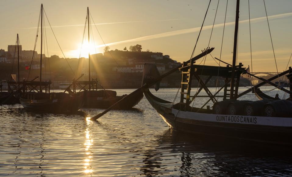 Rabelo. traditional boats for the transport of wine. Vila Nova de Gaia on the opposite side of river Douro. where most port wine cellars are located. City Porto (Oporto) at Rio Douro in the north of Portugal. The old town is listed as UNESCO world heritag