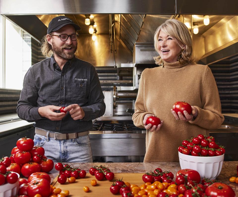 Jonathan Webb and Martha Stewart stand in a commercial kitchen
