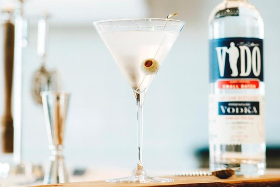 martini, olive, jigger and vodka bottle