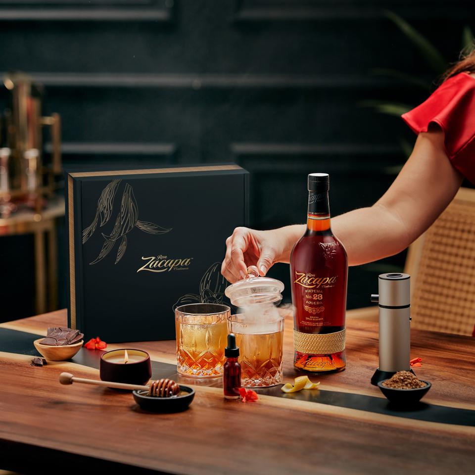 Zacapa rum cocktail kit with smoker, honey, dowel, and old fashioned glasses