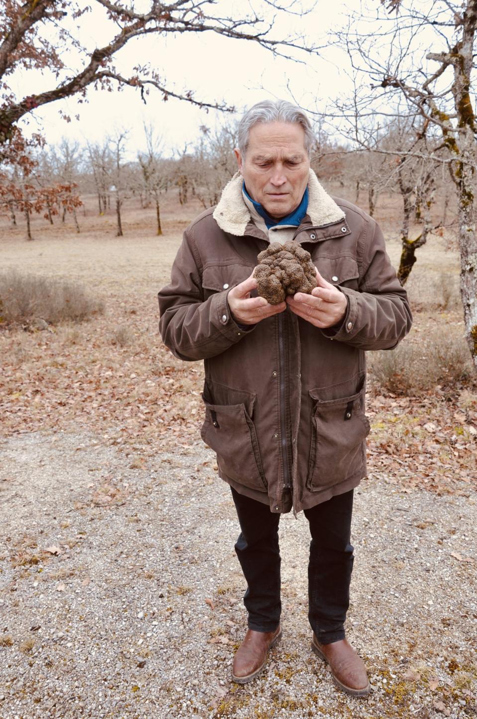 Bernard Planche holds his prized truffle.