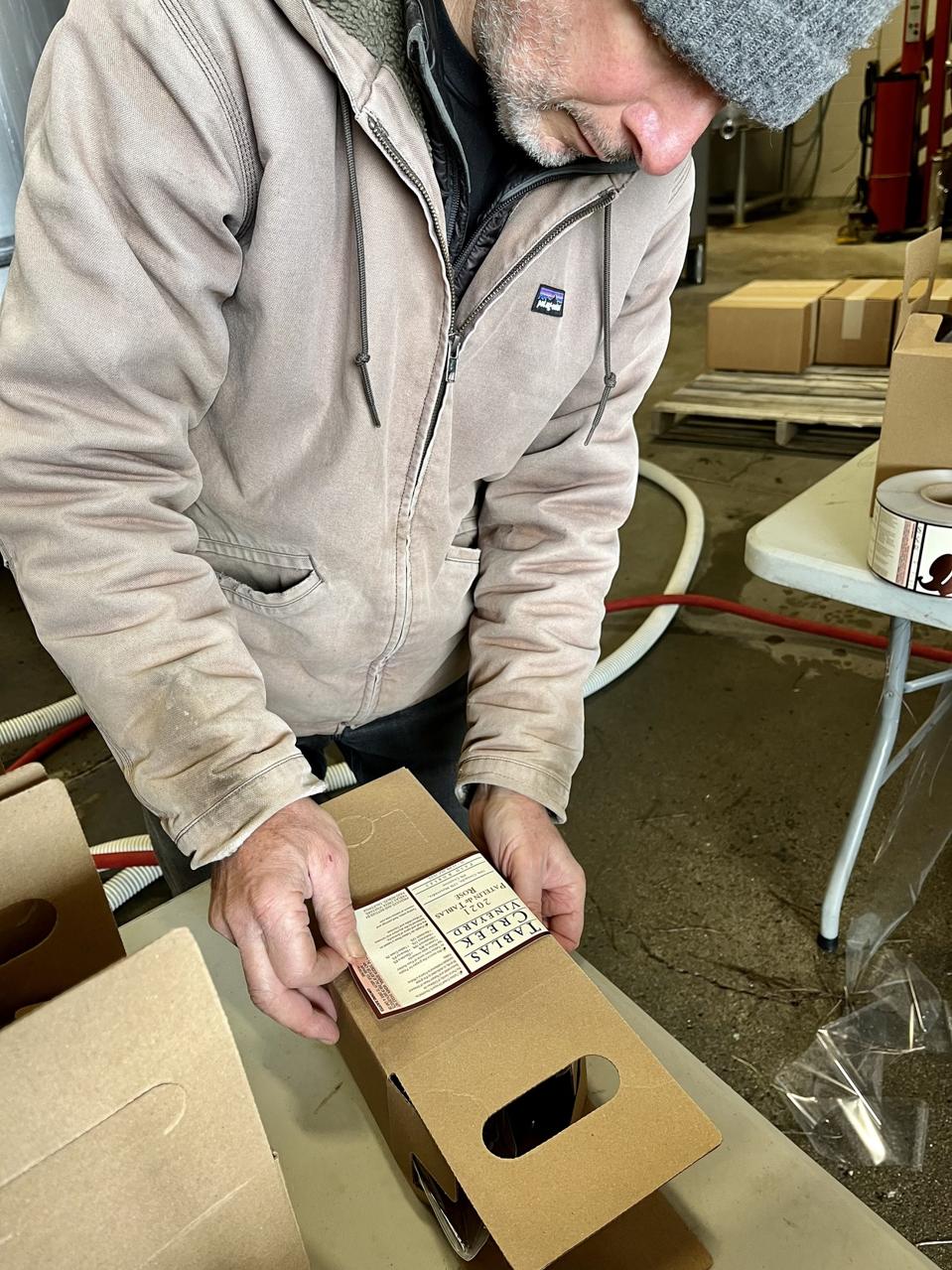 Gustavo Prieto hand labeling boxes