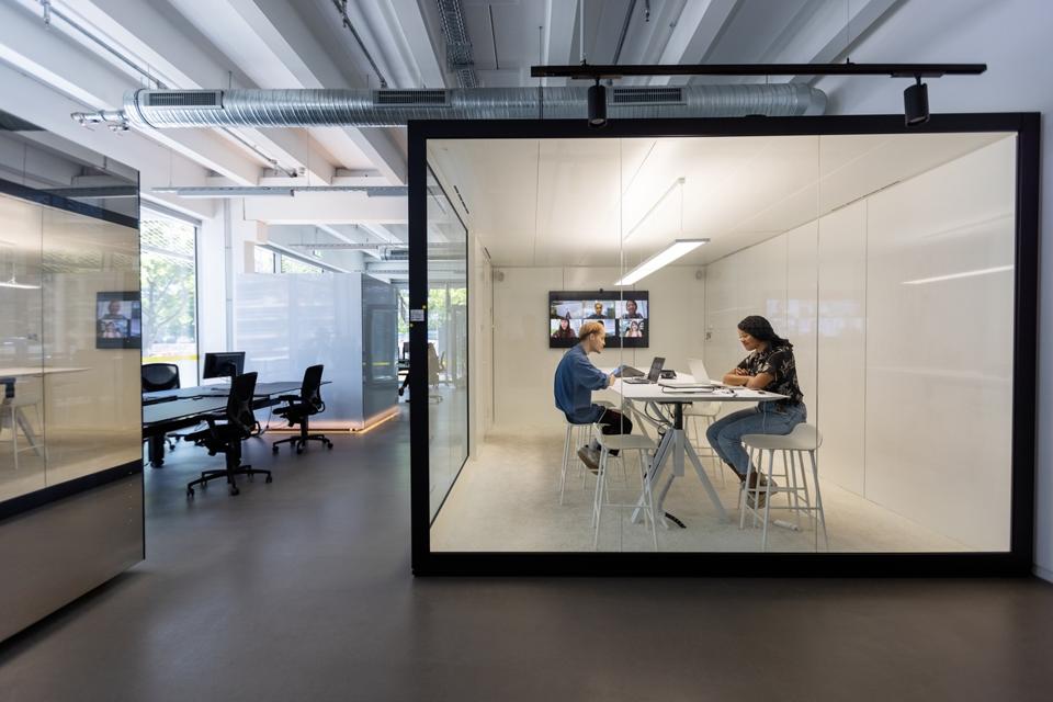Business people working in hybrid office space