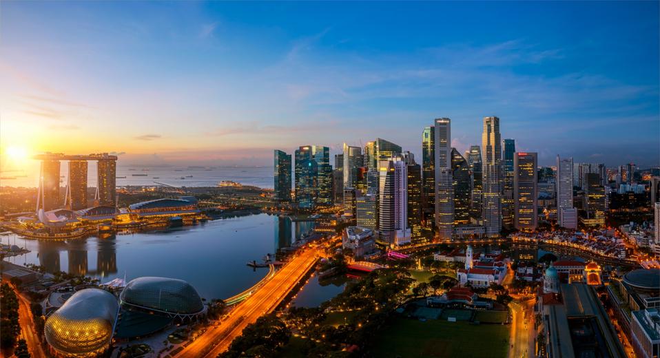 Singapore city and sunrise sky in harbour side view