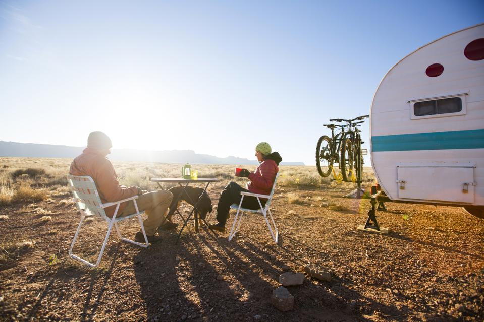 A couple camping in the desert.