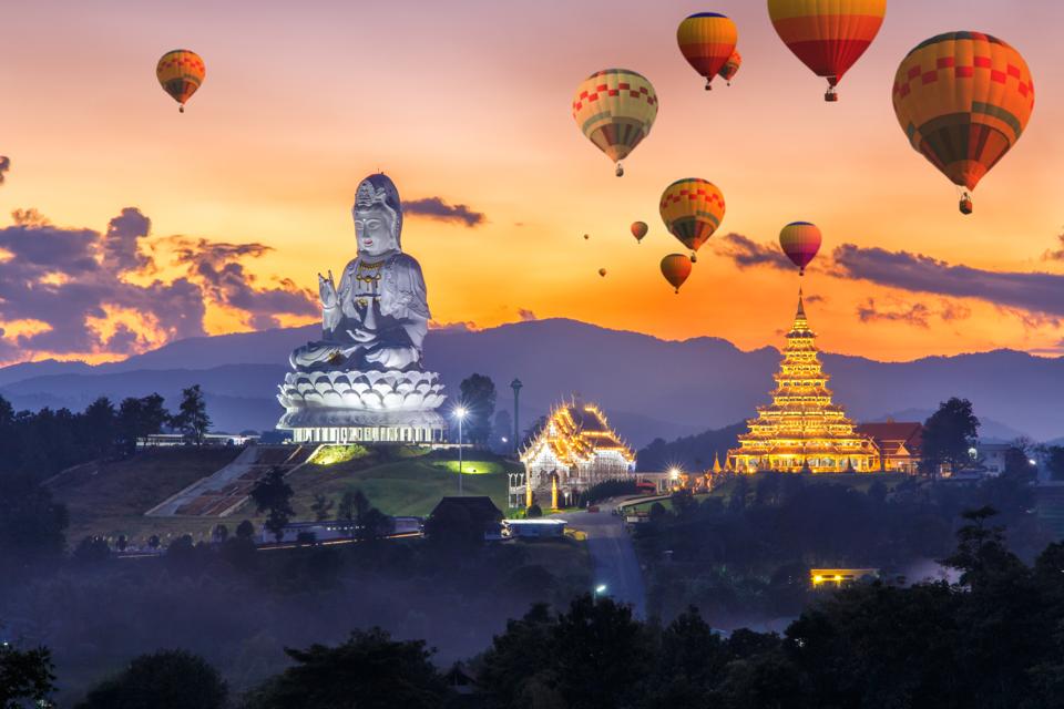 Colorful hot air balloons flying over Wat Huay Pla Kang