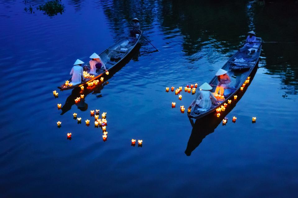 Floating candles in the Perfume River in Hue
