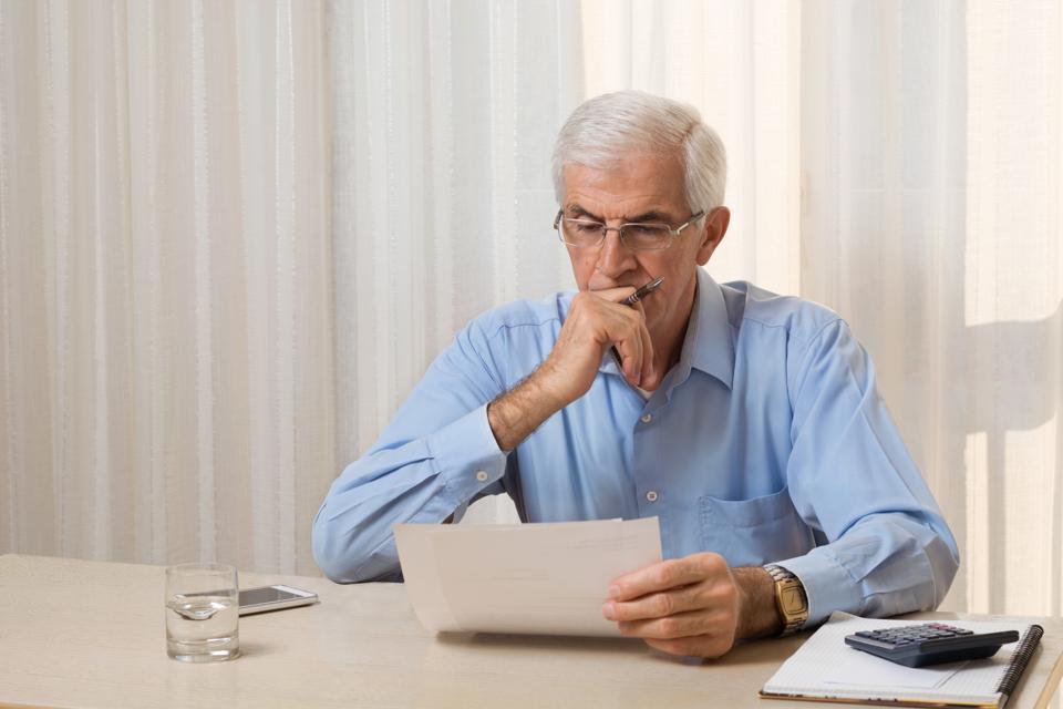 Older man doing his taxes