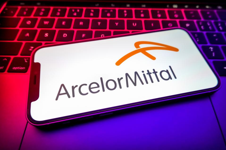 In this photo illustration, an ArcelorMittal logo seen...
