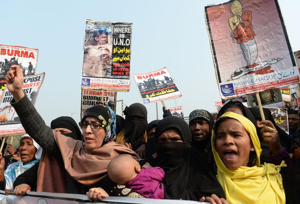 Rohingya Muslim refugees along with Indian supporters shout slogans against human rights violations... [+] in Myanmar, during a march to the United Nations High Commissioner for Refugees (UNHCR) office in New Delhi on December 19, 2016. Myanmar faces growing pressure from its neighbors over claims its army has carried out a bloody campaign of abuse against its Rohingya minority as ministers held emergency talks on the crisis. More than 27,000 from the Muslim ethnic group have fled northwestern Myanmar for Bangladesh since the start of November to escape a heavy-handed military counterinsurgency campaign. PRAKASH SINGH/AFP/Getty Images