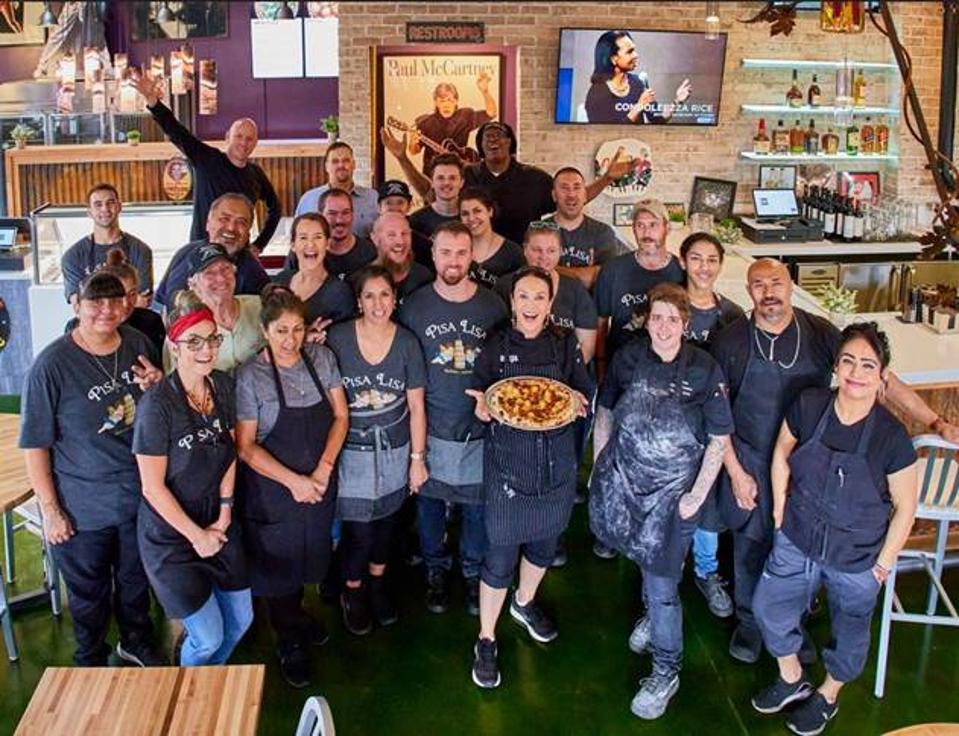 Chef Lisa Dahl with her opening team at Pisa Lisa Village of Oak Creek