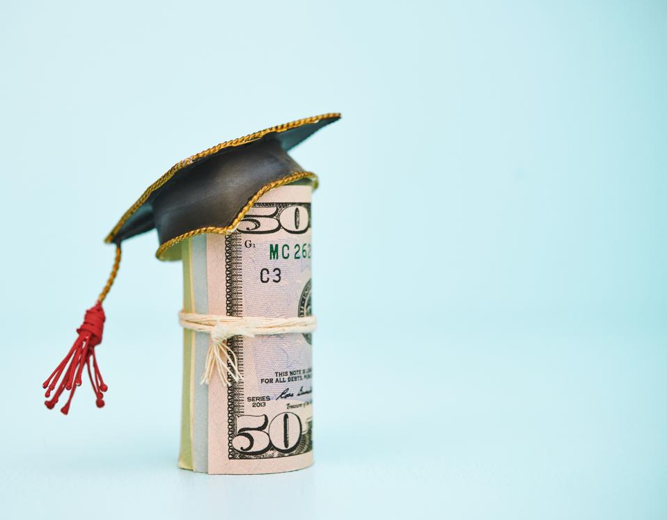 Cost of Education. Money roll wearing a mortarboard graduation cap