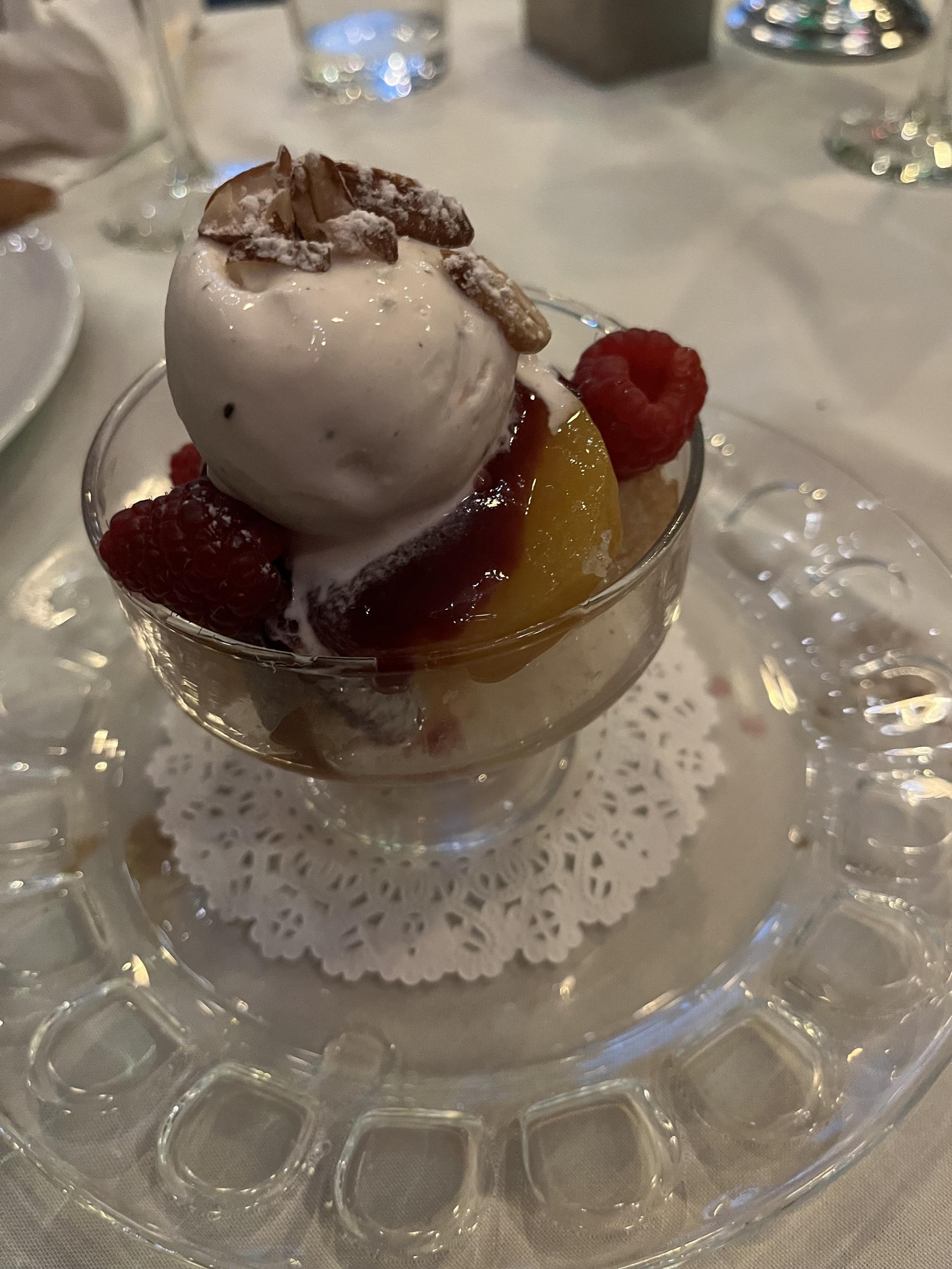 Peach Melba, topped with gelato.