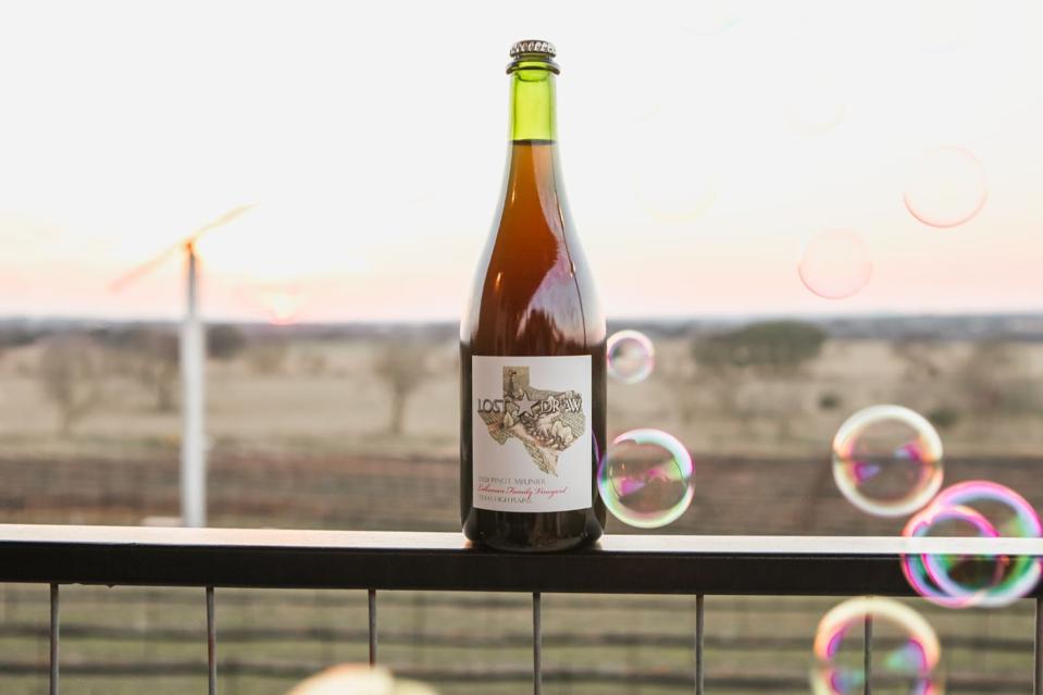 Bottle of wine on a steel fence