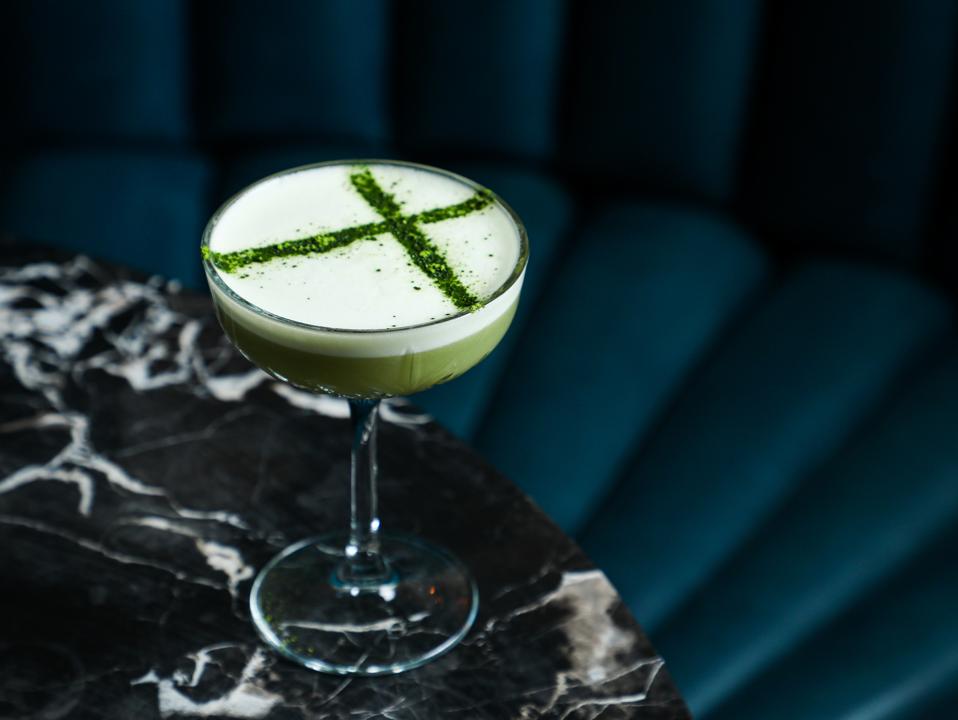 Peacock Room's Patchwork Quilt cocktail on a blue background