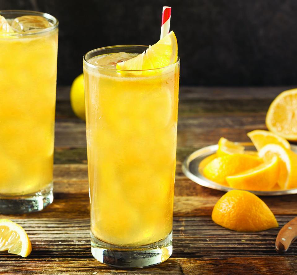 Angel's Firewater cocktails with orange wedges