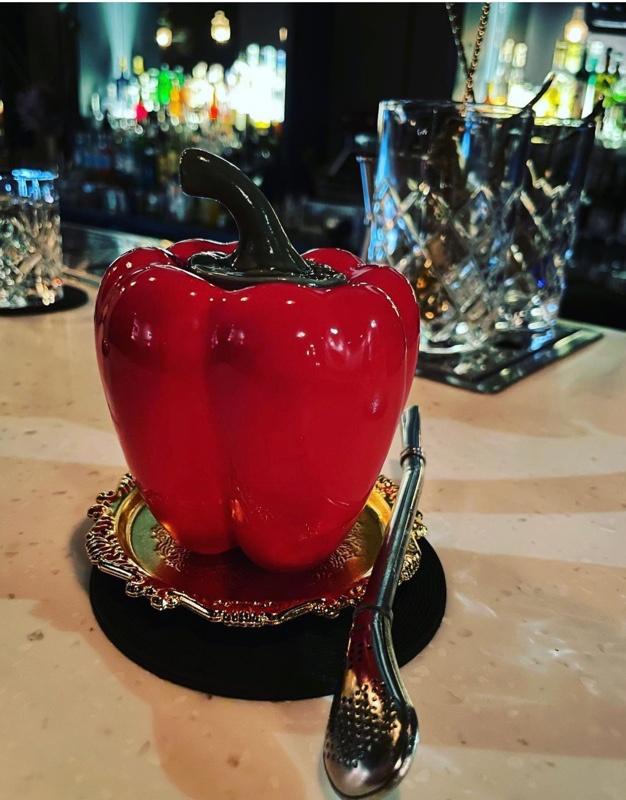 Devil's cocktail in a porcelain red pepper vessel