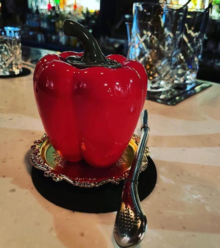 Devil's cocktail in a porcelain red pepper vessel