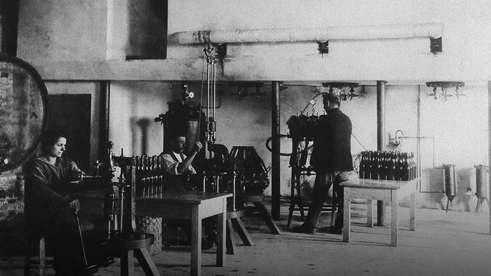 Historical photo of early wine production from the Valdo archives