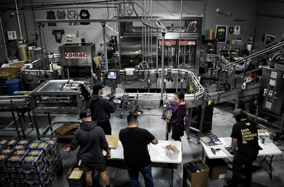 Amy Cartwright and the Independence team on the canning room floor.