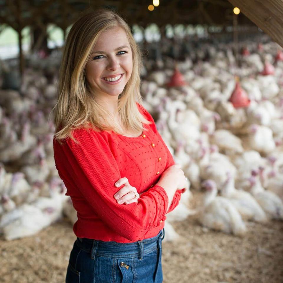 Heidi Diestel is part of the fourth generation team that runs the Diestel Family Ranch and thoughtfully raises a variety of turkeys. She is shown here with a flock of Diestel turkeys in the background.