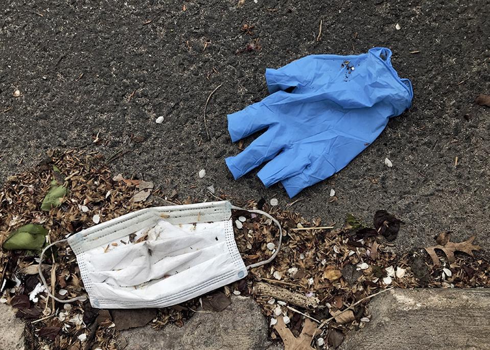 Gloves and masks litter a New York street during pandemic