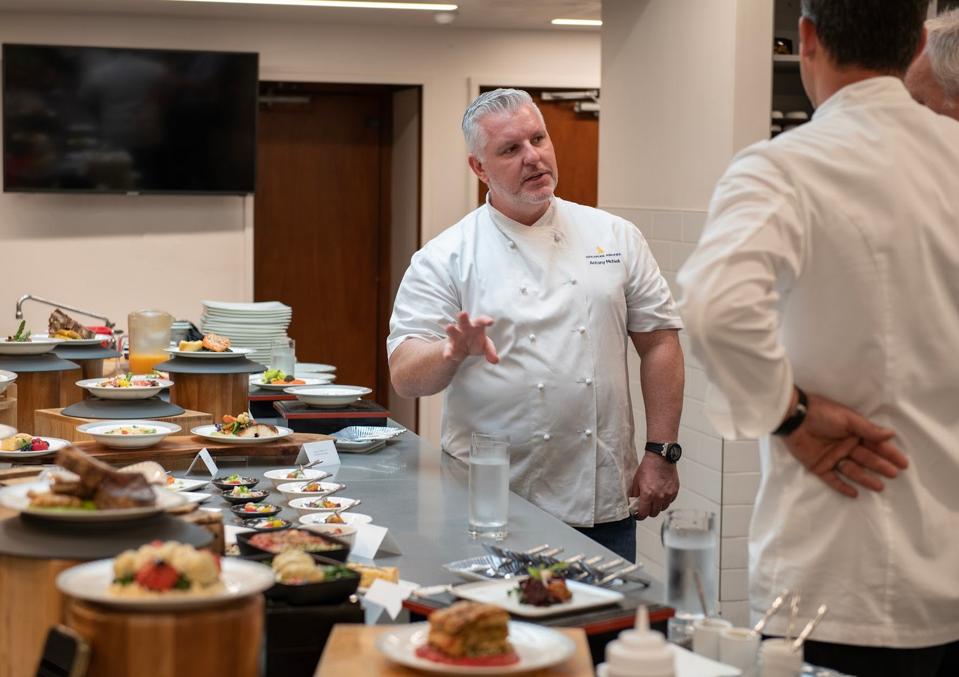 men talk in the kitchen