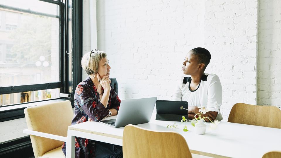 2023 Real Estate Technology Transformation: 5 Game-Changing Trends 31 Businesswomen discussing project in office conference room