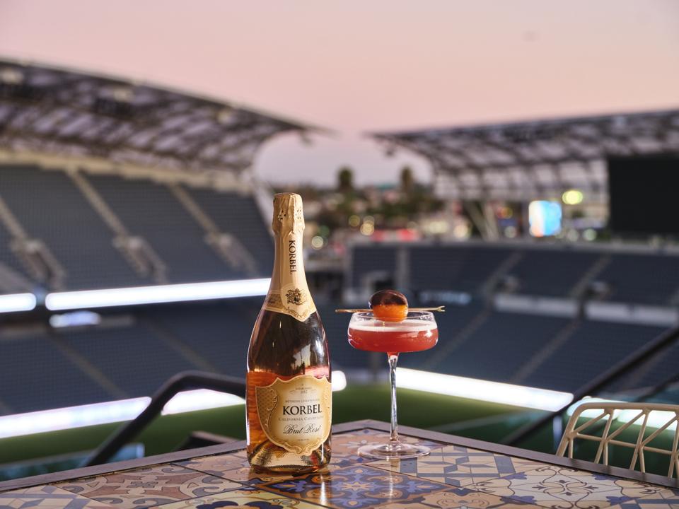 Bottle of Korbel brut rose with a cocktail glass on the side