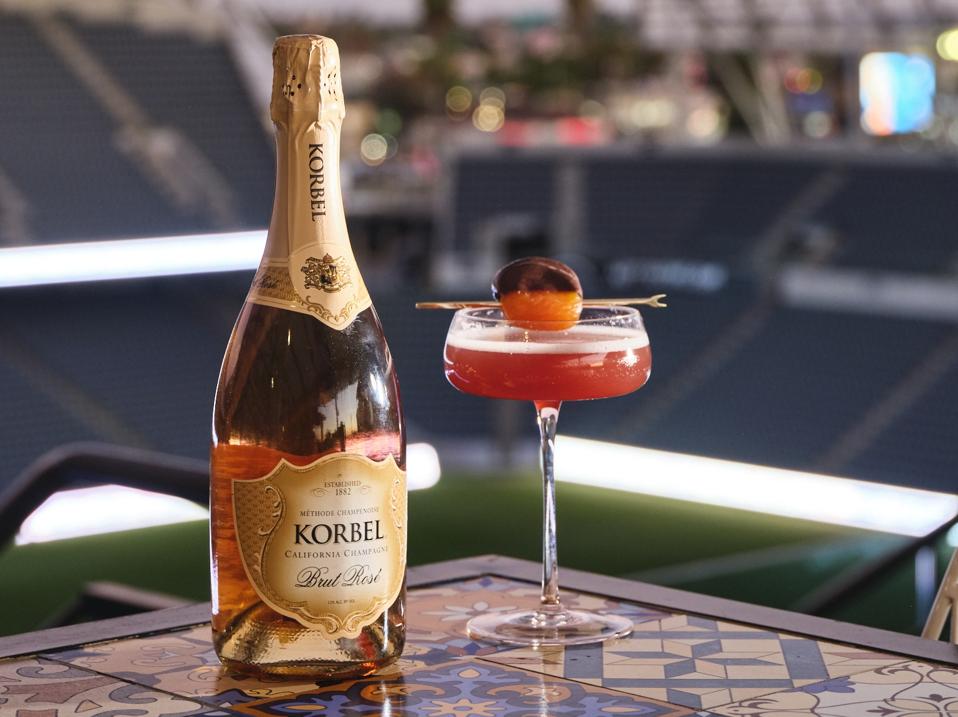 Bottle of Korbel brut rose with a cocktail glass on the side