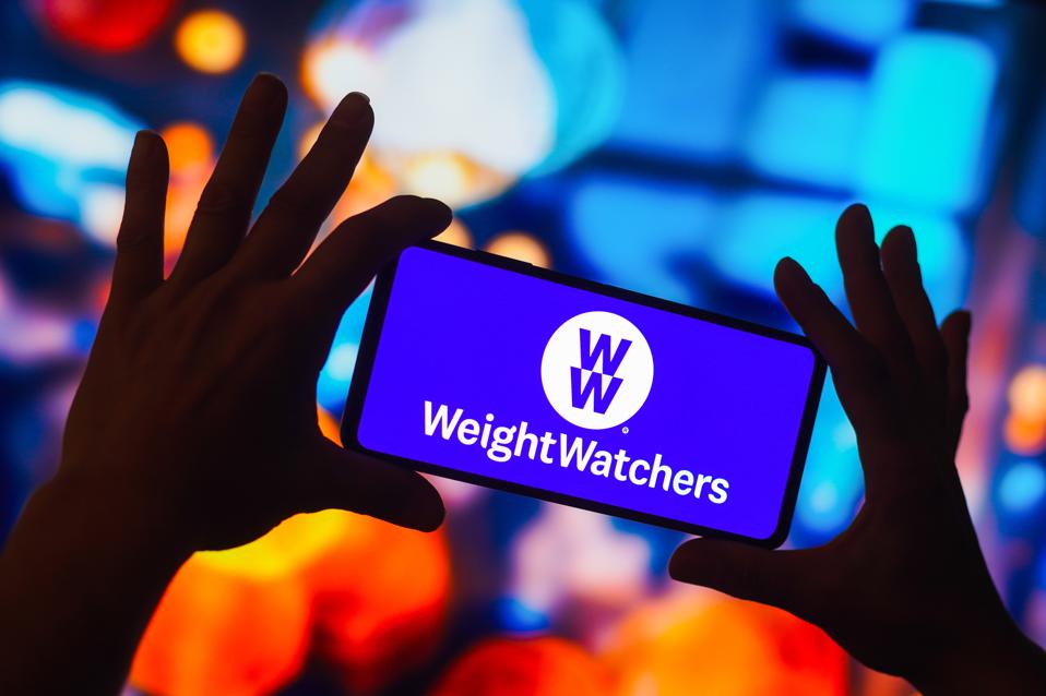 In this photo illustration, the Weight Watchers (WW...