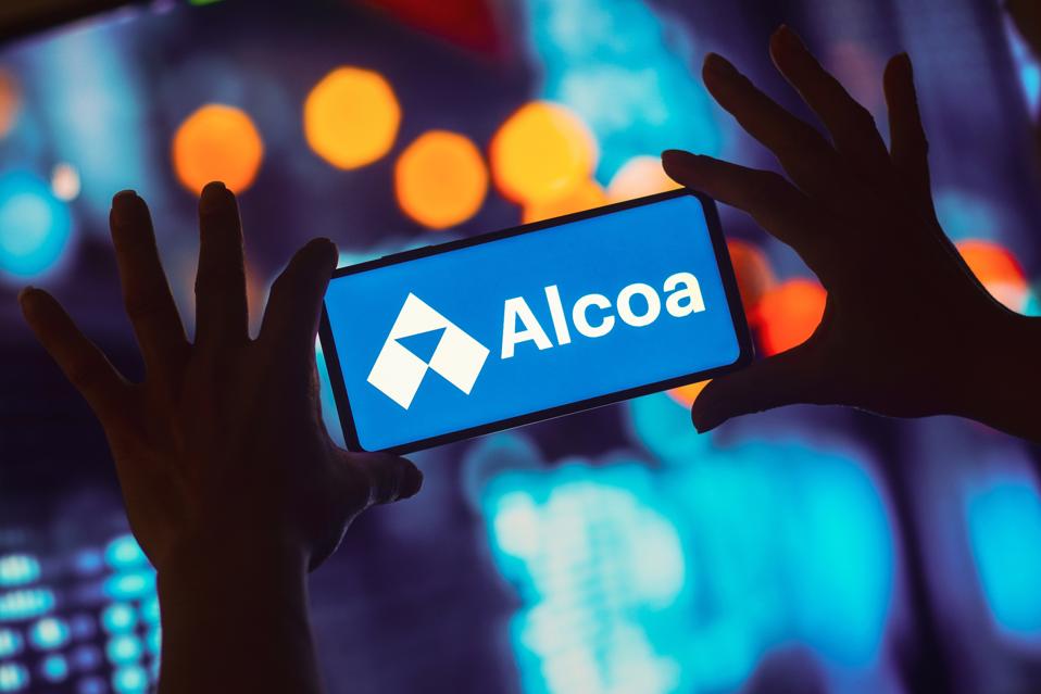 In this photo illustration, the Alcoa logo is displayed on a...