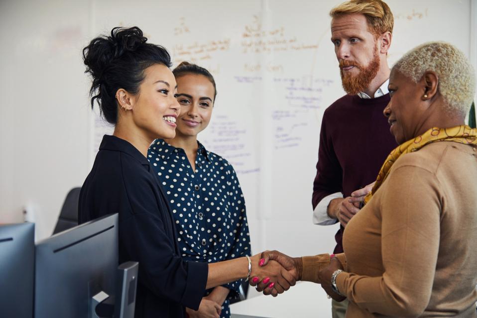 Group of people at a start up business having a project meeting