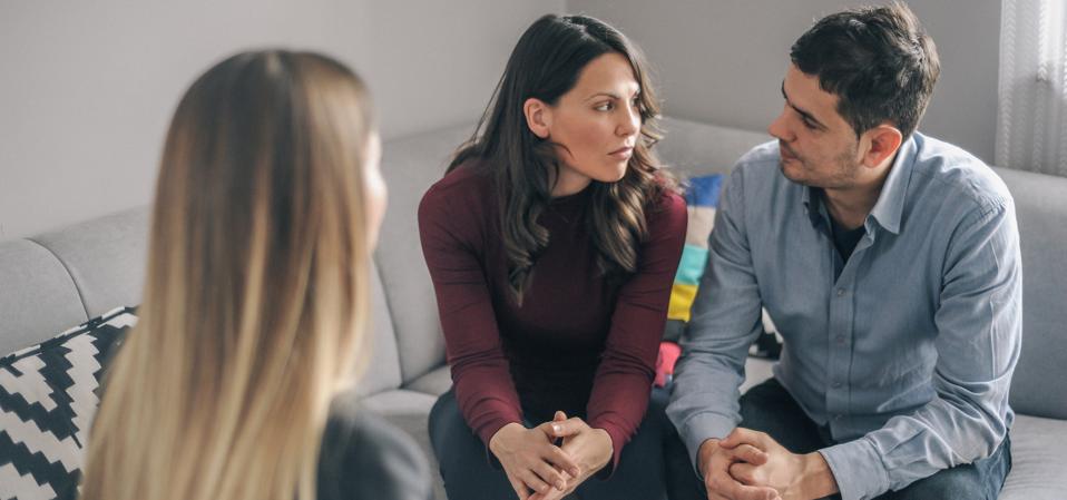 Expecting couple on home counselling meeting